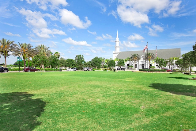 view of property's community with a yard