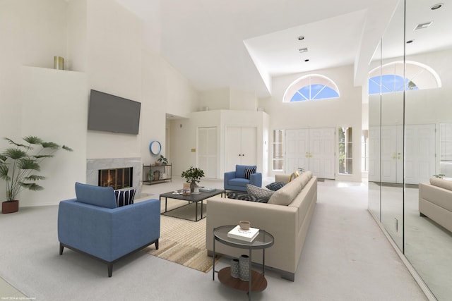 carpeted living room featuring a premium fireplace and a high ceiling