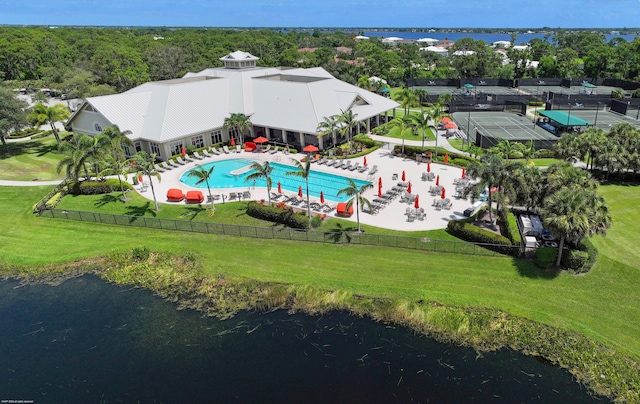 birds eye view of property with a water view