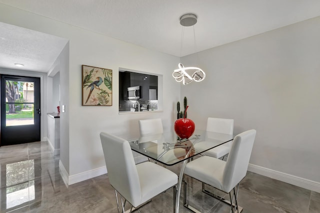 dining room with a textured ceiling