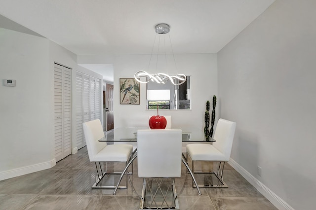 dining area featuring a chandelier