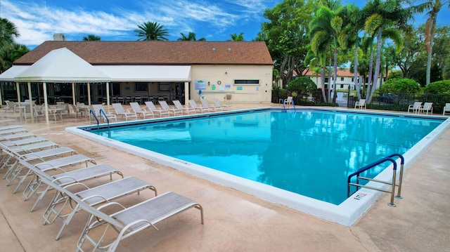 view of swimming pool featuring a patio