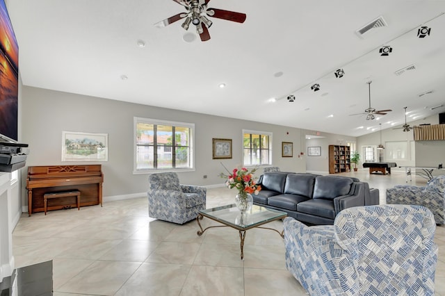 tiled living room featuring lofted ceiling and ceiling fan