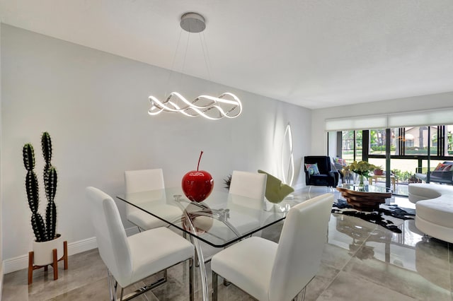 dining area featuring an inviting chandelier