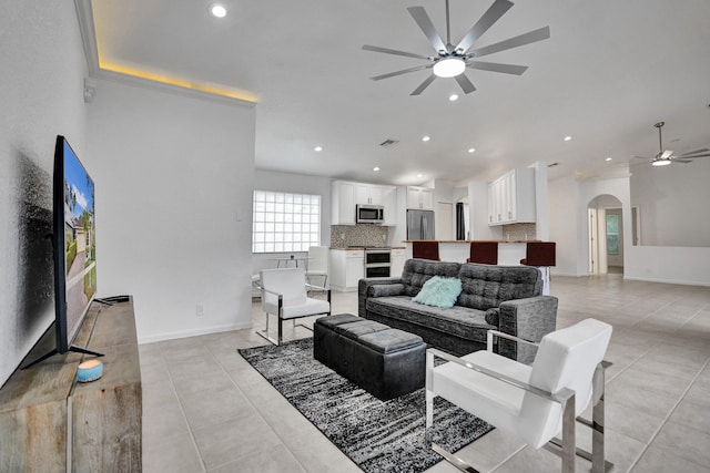 living room with light tile patterned flooring and ceiling fan