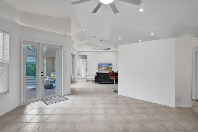 interior space featuring lofted ceiling, light tile patterned floors, and ceiling fan