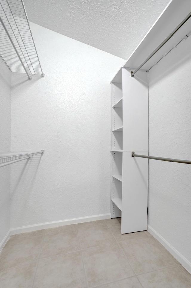 walk in closet featuring light tile patterned floors