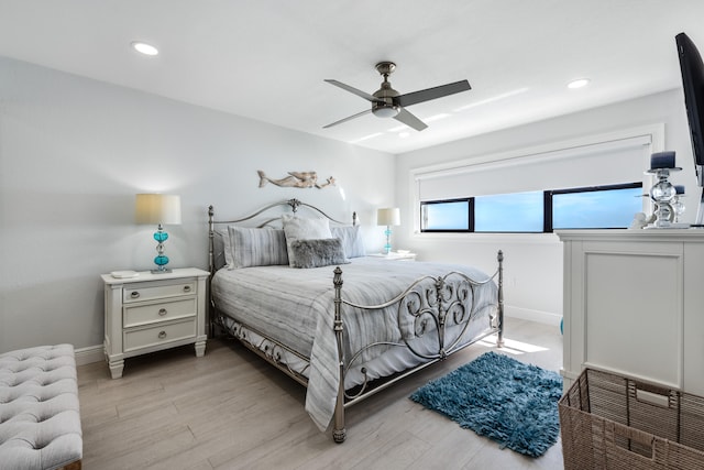 bedroom featuring light hardwood / wood-style floors and ceiling fan