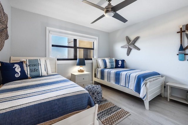 bedroom featuring ceiling fan and light hardwood / wood-style floors