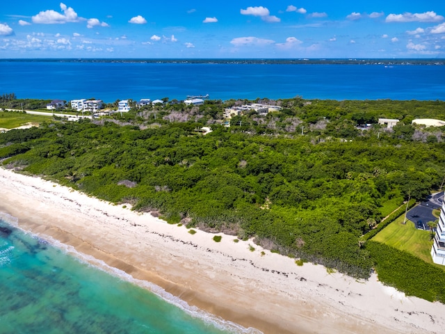 birds eye view of property featuring a water view and a view of the beach