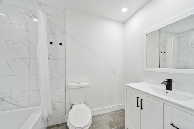 full bathroom featuring vanity, toilet, tiled shower / bath, and tile patterned floors