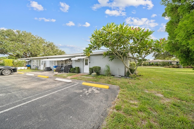 view of front of home with a front yard