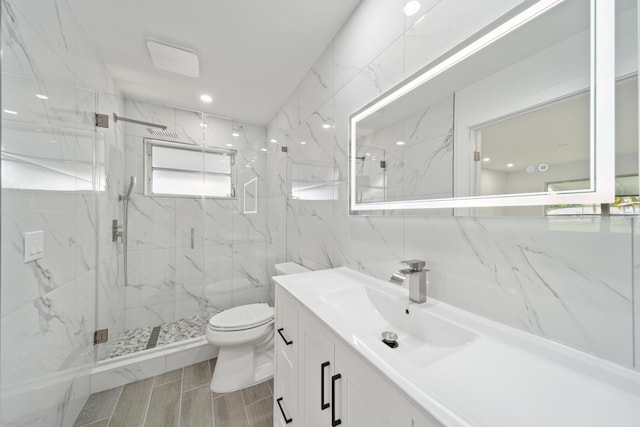 bathroom featuring an enclosed shower, tile walls, tile patterned flooring, toilet, and vanity