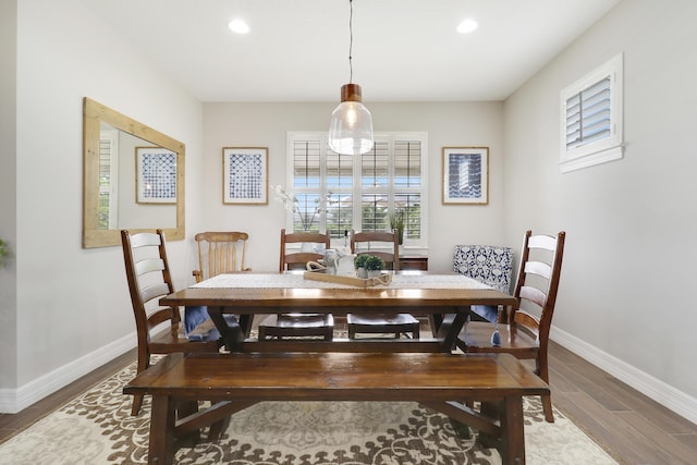 dining space featuring dark hardwood / wood-style flooring