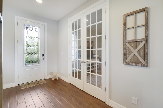 entryway featuring dark hardwood / wood-style floors and french doors