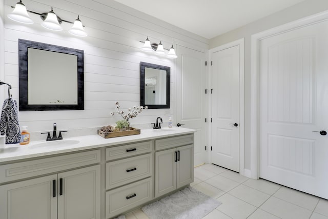 bathroom with tile patterned floors and vanity