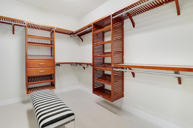 spacious closet with light tile patterned flooring