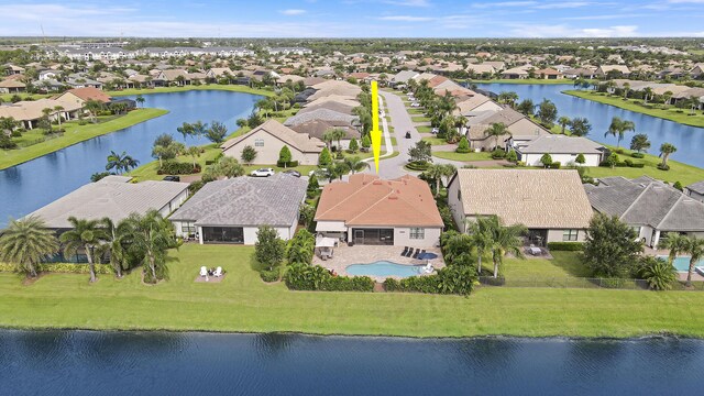 birds eye view of property featuring a water view