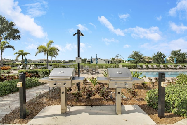 view of patio featuring area for grilling and a community pool