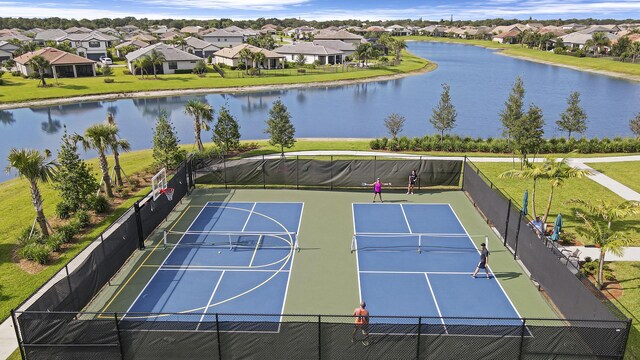 birds eye view of property with a water view