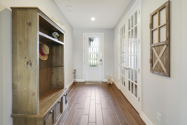 mudroom with dark hardwood / wood-style flooring and french doors