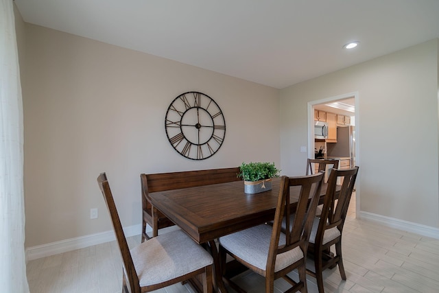 dining room with light hardwood / wood-style flooring