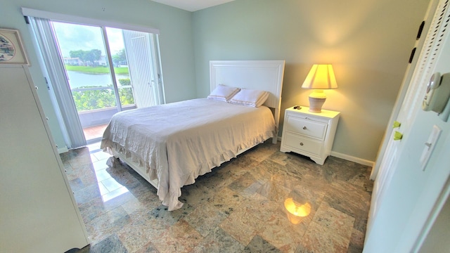 bedroom featuring a water view