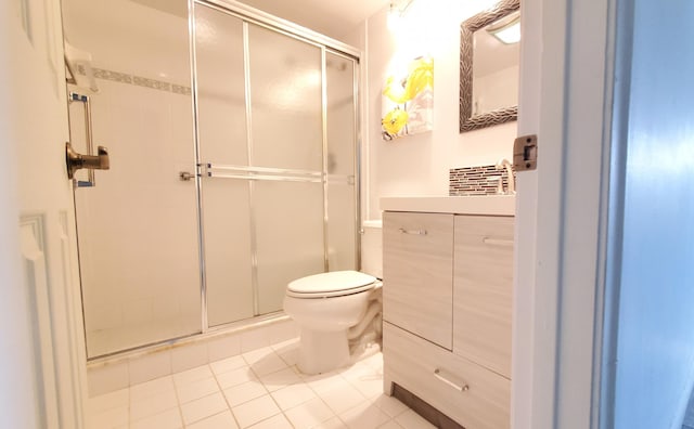 bathroom with walk in shower, tile patterned floors, and toilet