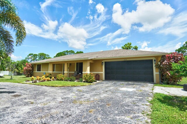 single story home with a garage