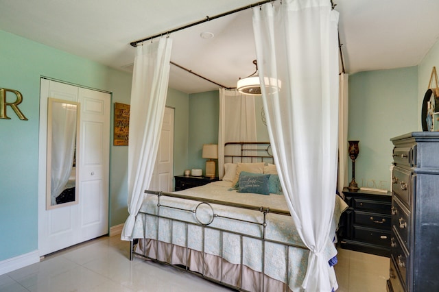 bedroom with light tile patterned flooring