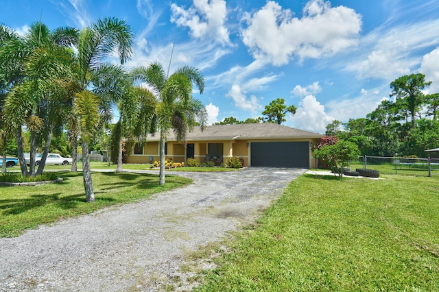 view of front facade featuring a garage and a front lawn