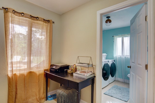 washroom with tile patterned flooring and washing machine and clothes dryer