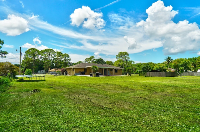 view of yard with a trampoline