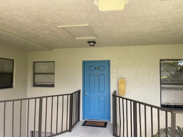 entrance to property with a balcony