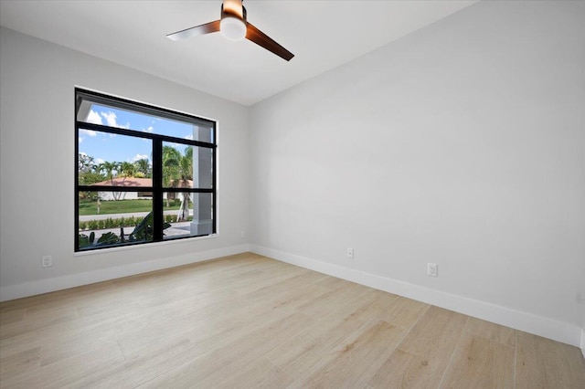 spare room with ceiling fan and light hardwood / wood-style floors