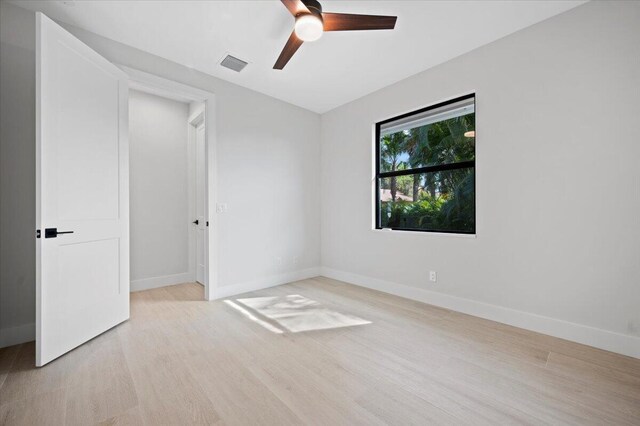 unfurnished room featuring ceiling fan and light wood-type flooring