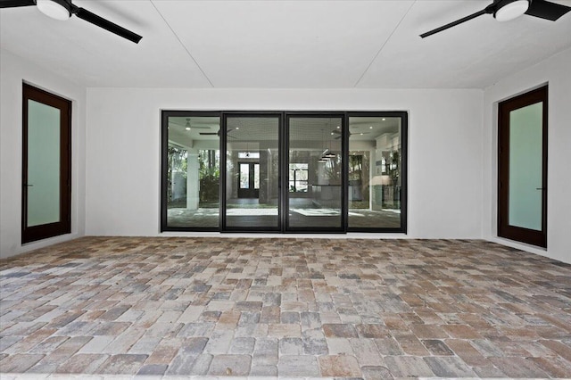 interior space with french doors and ceiling fan