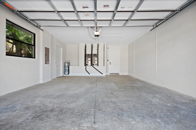 garage featuring a garage door opener and electric panel