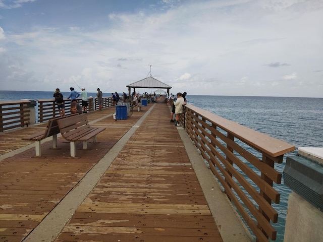 view of dock with a water view and a gazebo