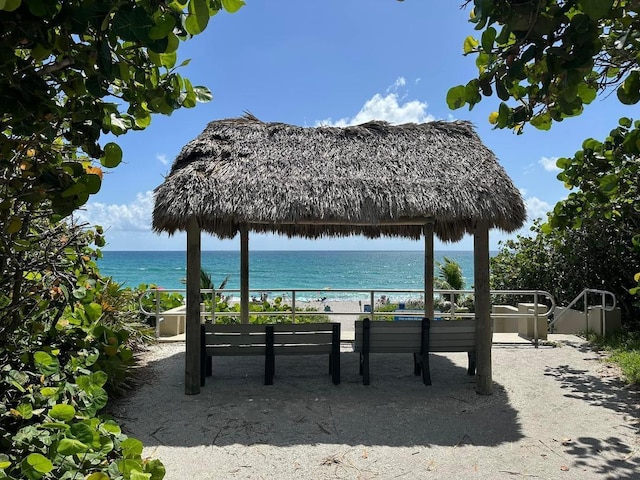 view of community with a gazebo and a water view