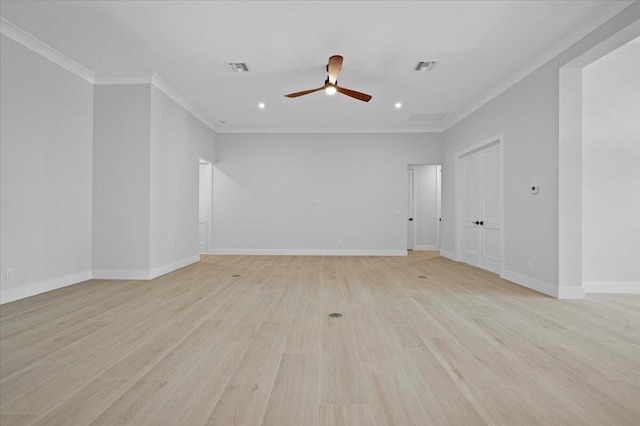 spare room featuring light hardwood / wood-style flooring, ornamental molding, and ceiling fan