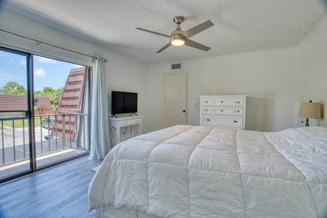 bedroom featuring light hardwood / wood-style floors, access to exterior, and ceiling fan