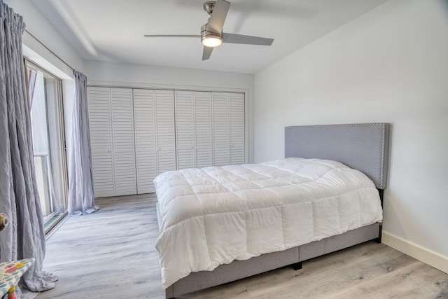 bedroom featuring light hardwood / wood-style flooring, a closet, and ceiling fan