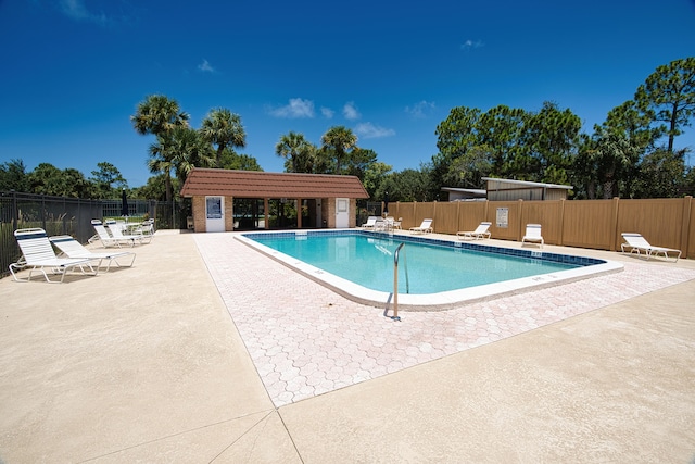 view of swimming pool with a patio