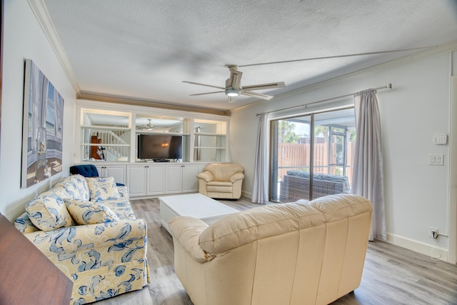 living room with light hardwood / wood-style floors, a textured ceiling, crown molding, and ceiling fan