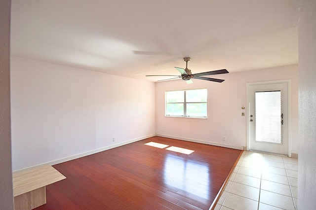 spare room featuring ceiling fan and light hardwood / wood-style flooring