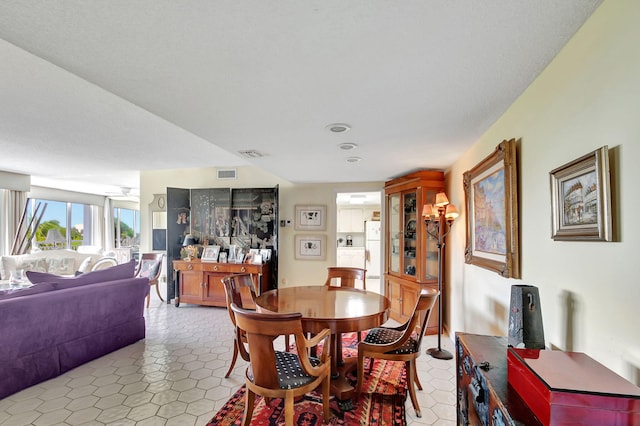 dining area featuring light tile patterned flooring