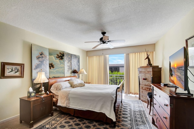 bedroom featuring a textured ceiling and ceiling fan