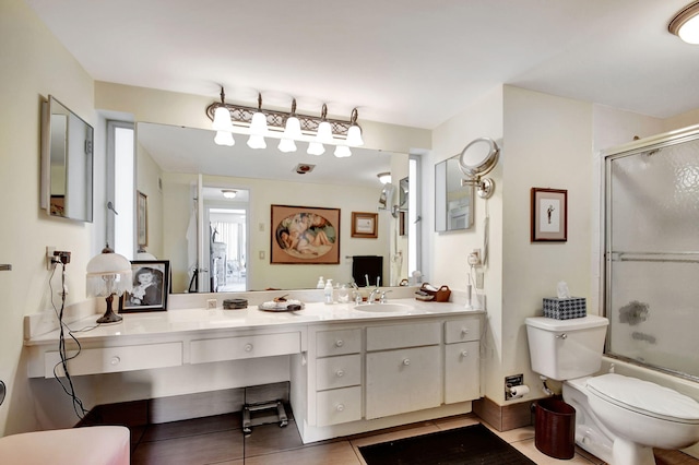 bathroom featuring vanity, toilet, and tile patterned floors