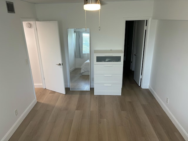 unfurnished bedroom featuring wood-type flooring